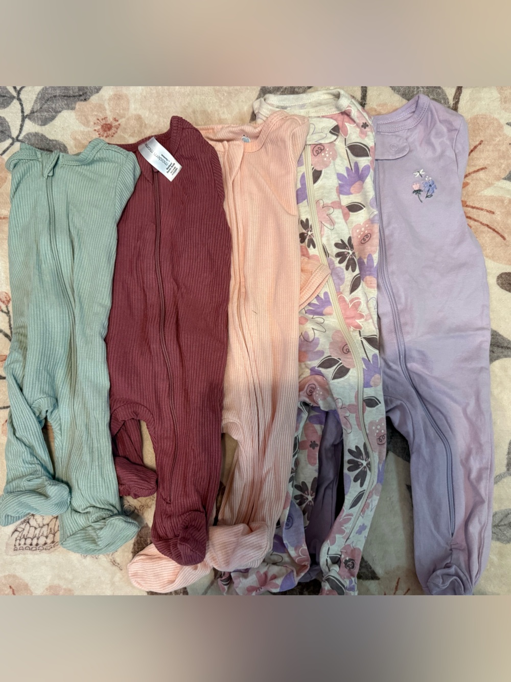 Bundle of girl newborn sleepers